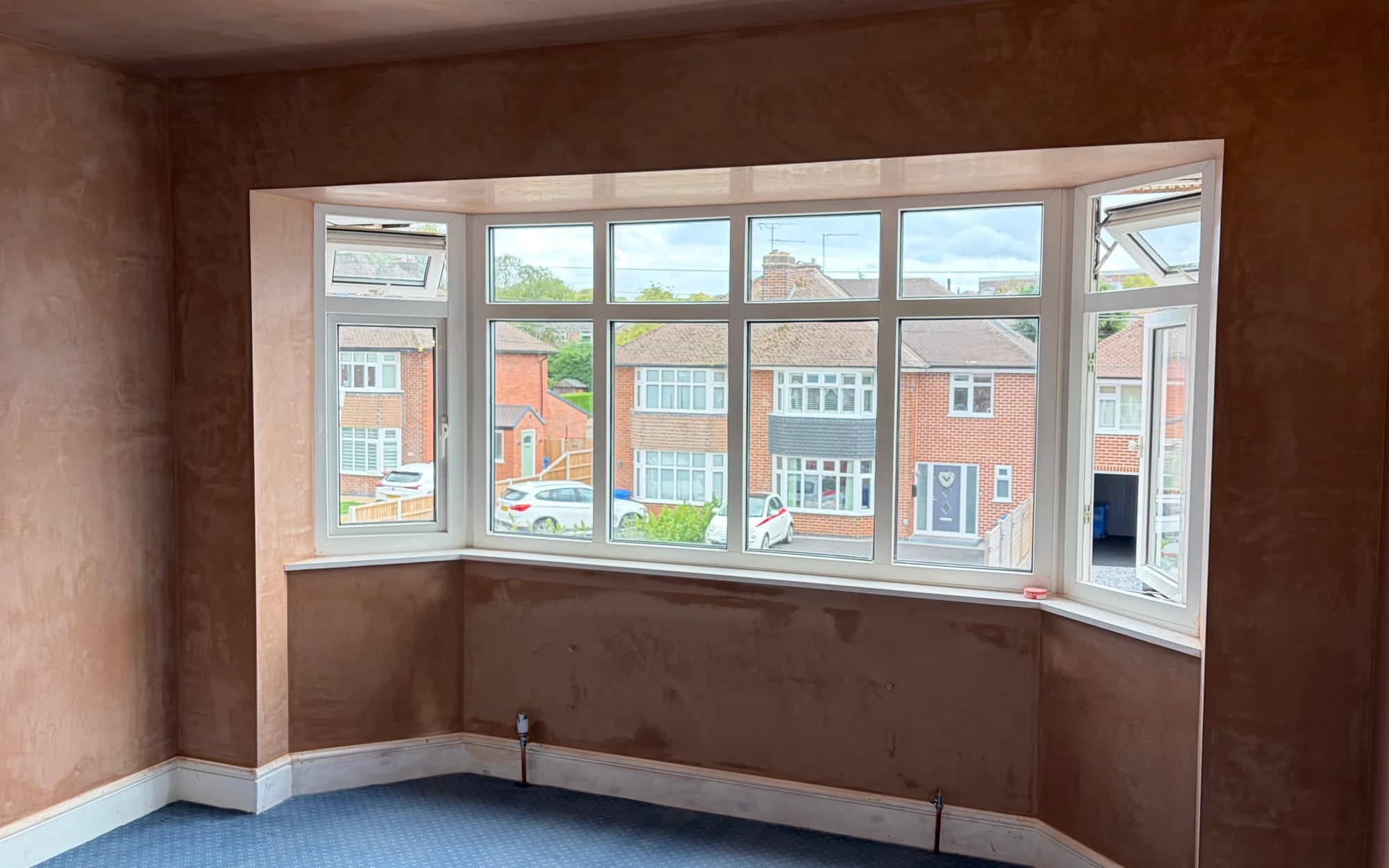 Freshly plastered bedroom bay window and surrounding walls in Allestree