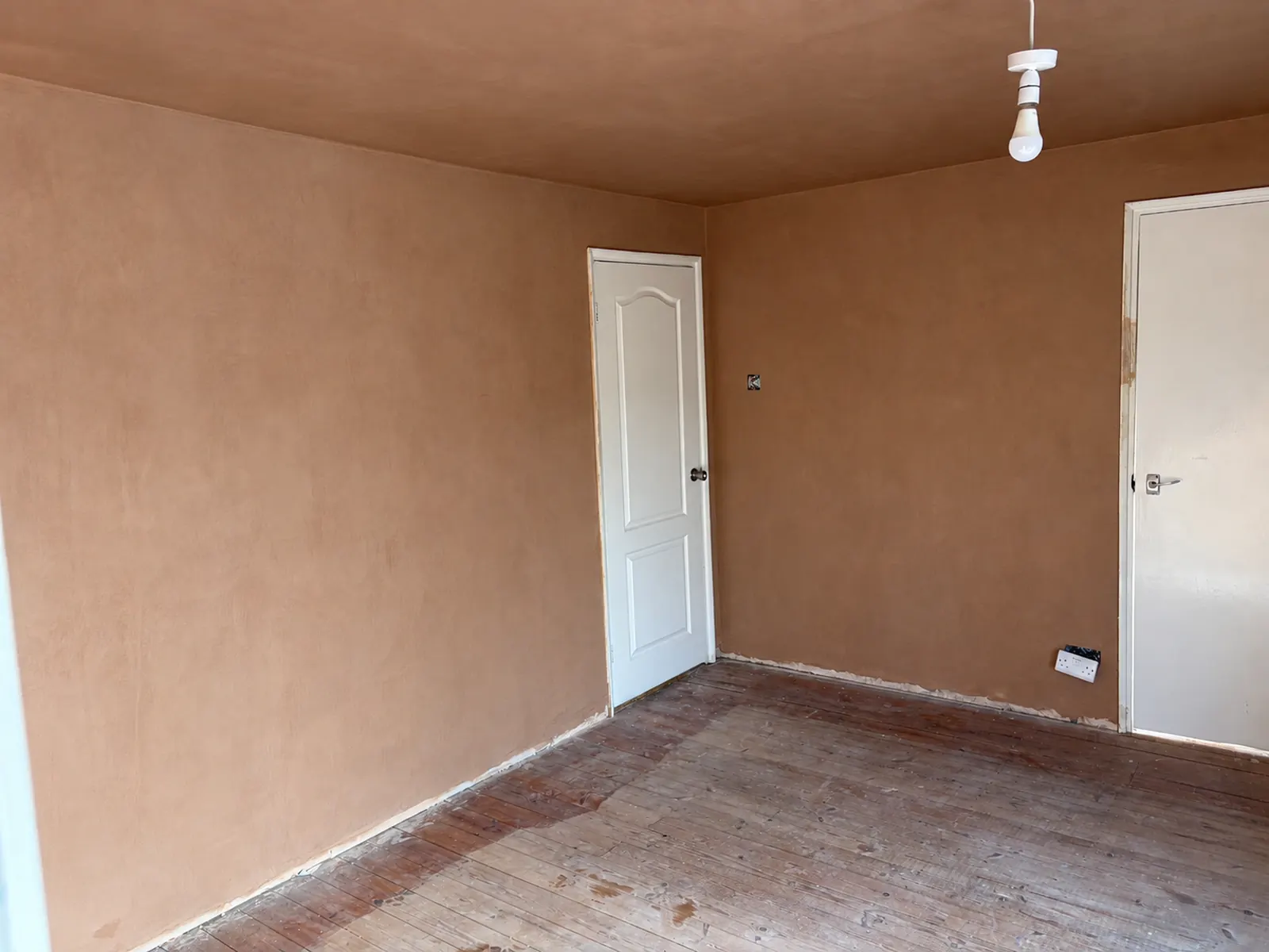 Freshly skimmed walls and ceiling beside the bedroom and cupboard doors in Allestree