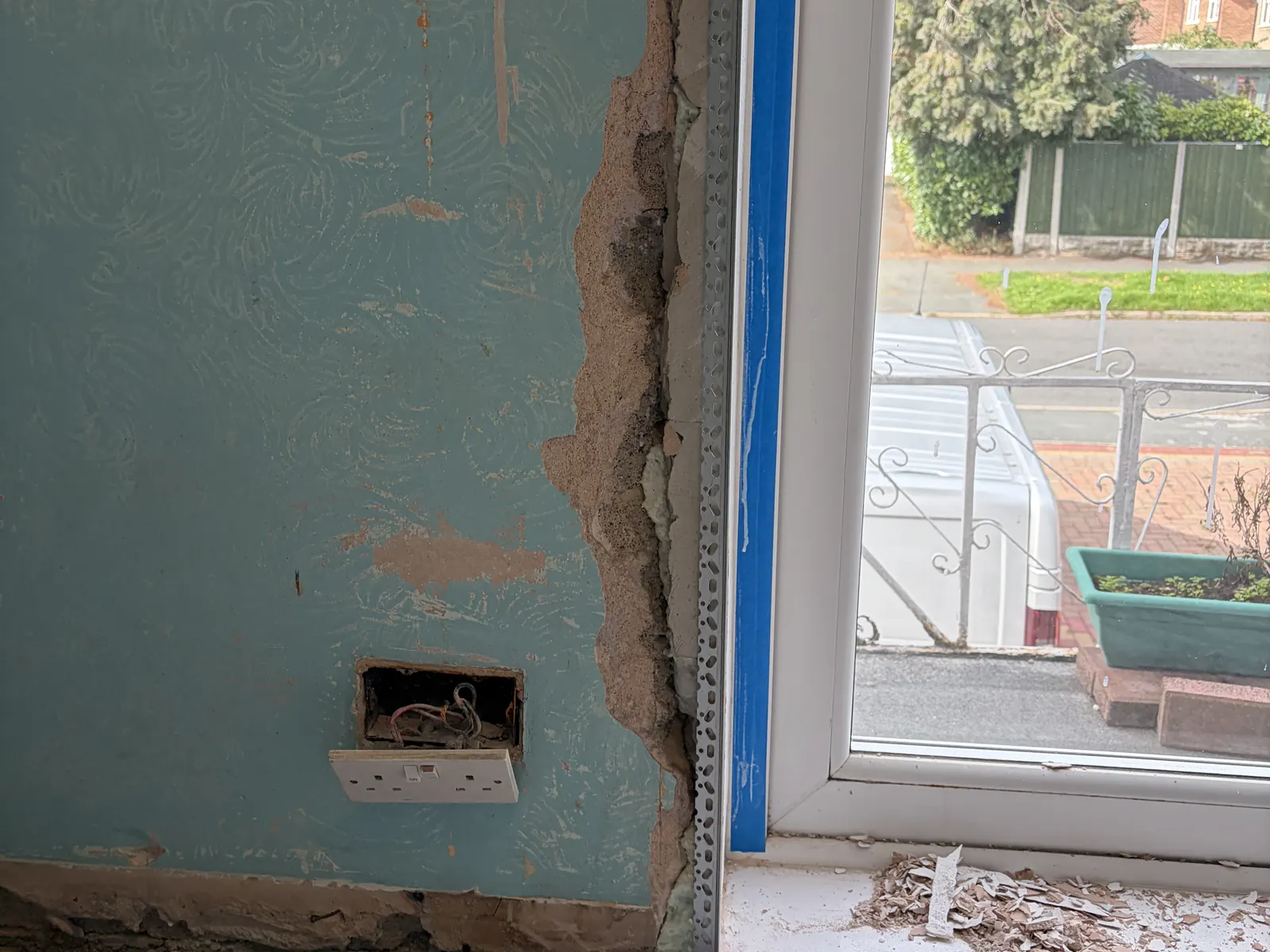 Damaged plaster at the edge of a bedroom wall in Allestree before repair