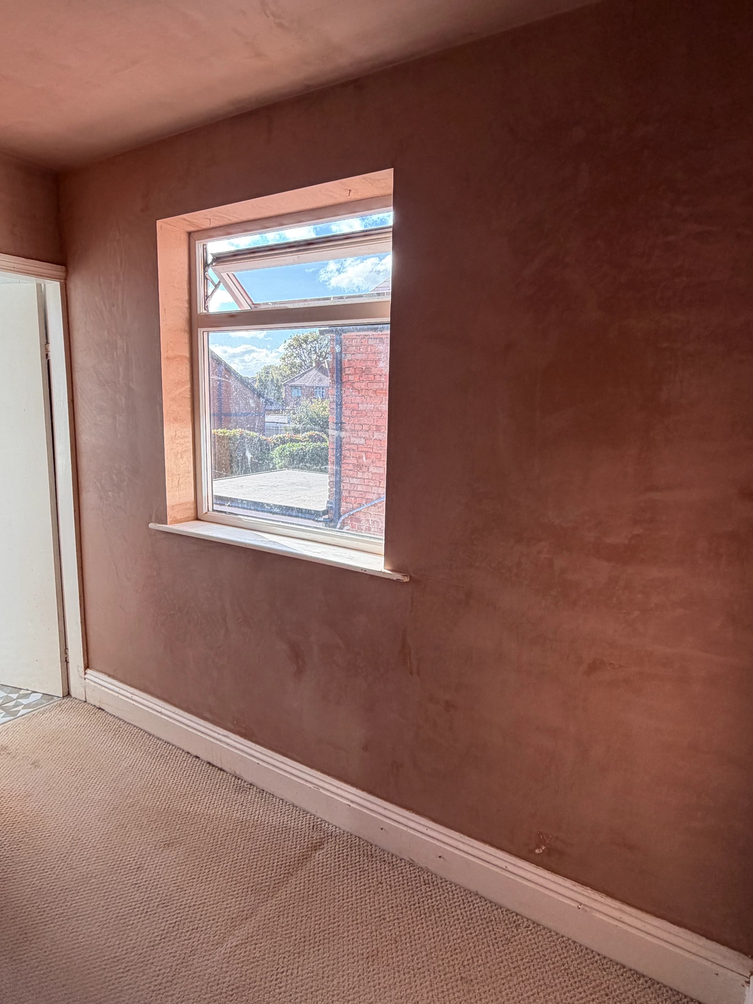 Fresh plaster around the window reveals and across the window wall in the Alvaston bedroom
