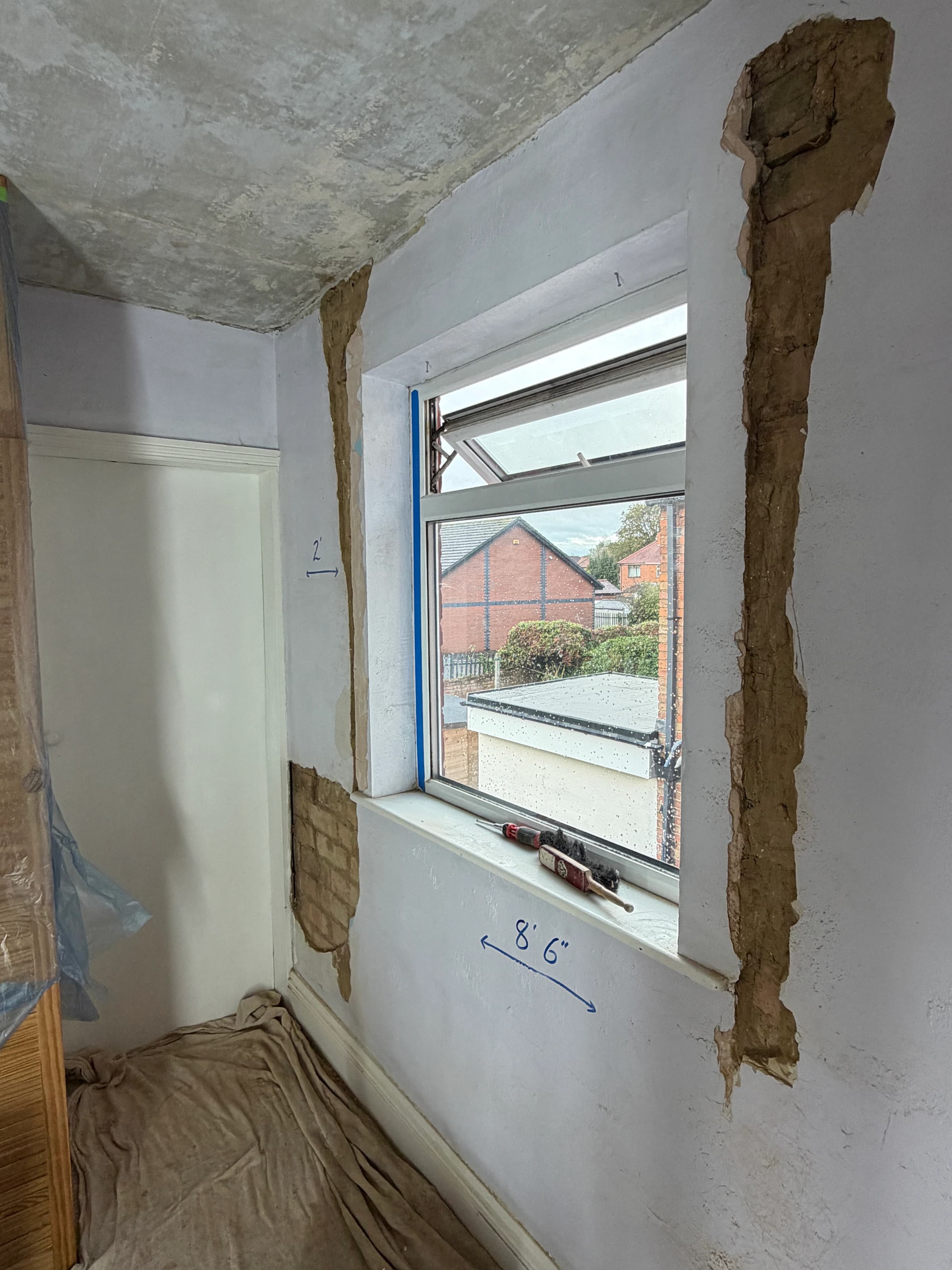 Damaged plaster removed from both sides of the Alvaston bedroom window before repairs