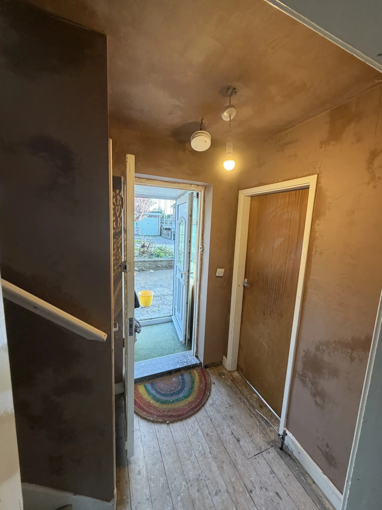 Fresh plaster finish across a landing and ceiling